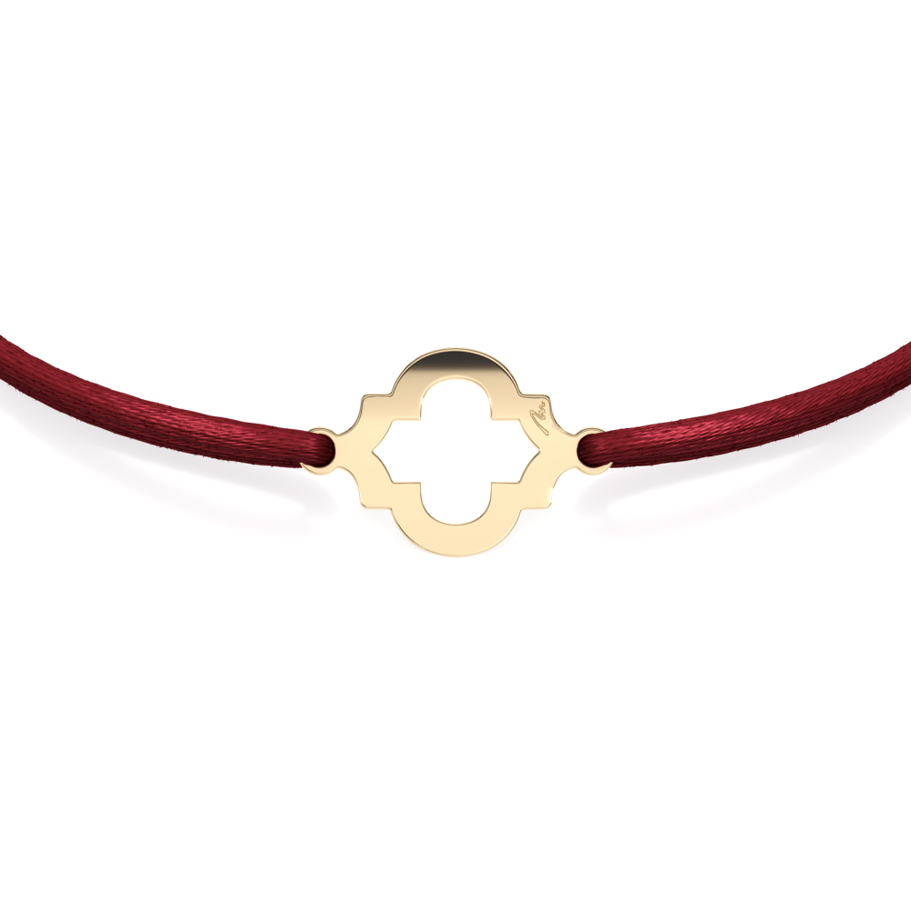 14 KT yellow gold Heart of Orient bracelet on string