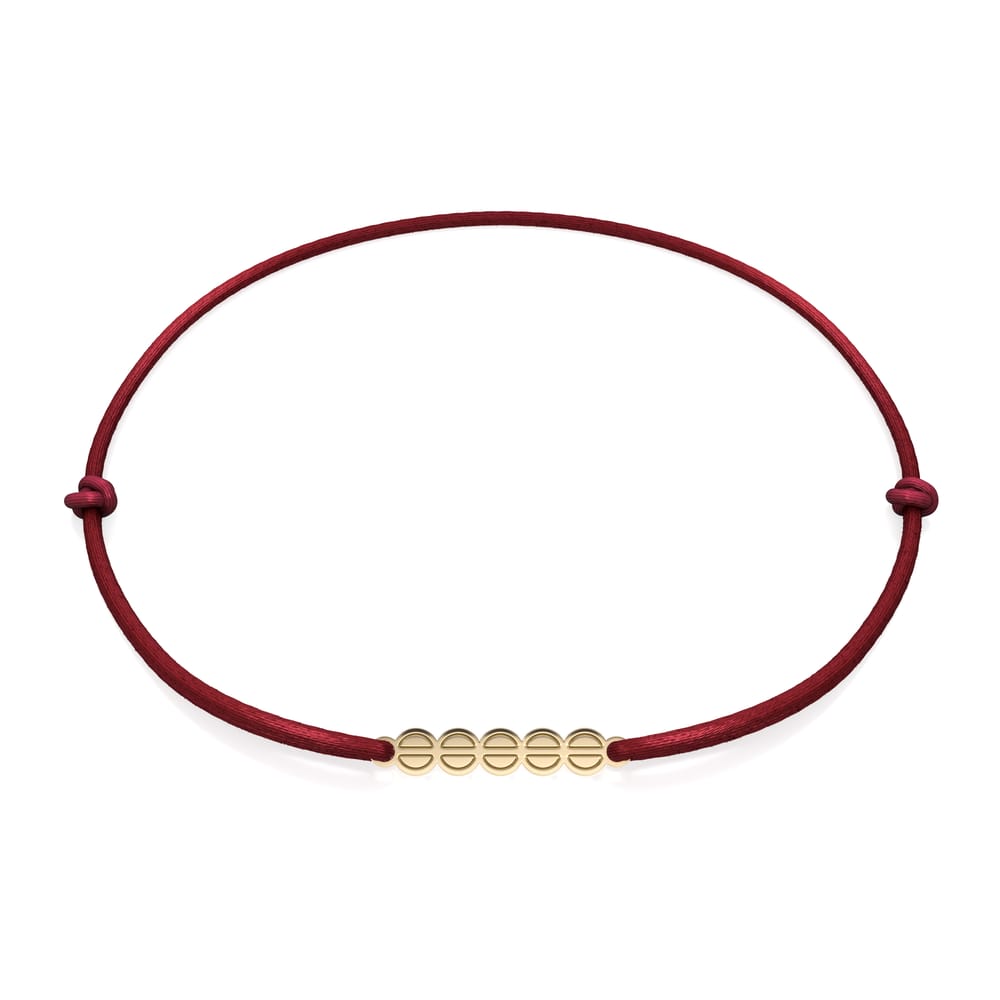 14 KT yellow gold The Embrace bracelet on string