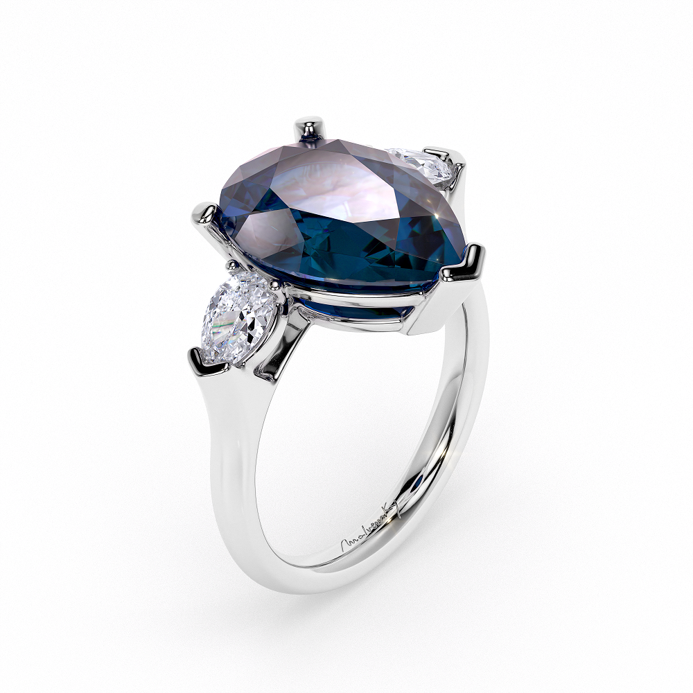 Trilogy Ring Pear Cut London Blue Topaz 6 CT and diamonds